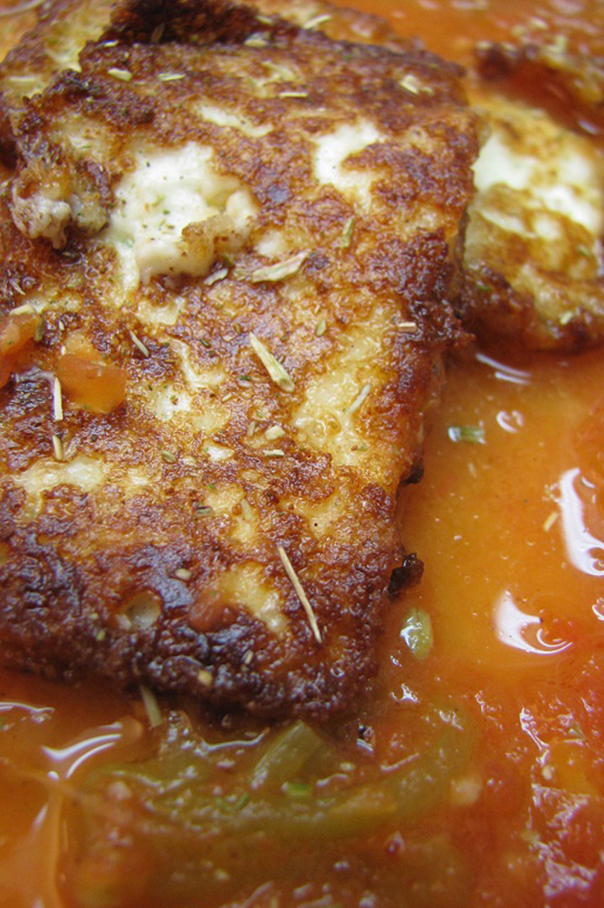 Mexican fried cheese with tomato broth and epazote
