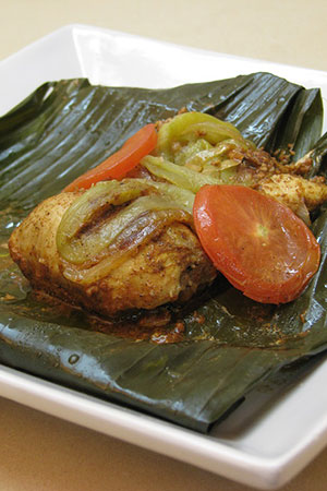 Mexican chicken pibil wrapped in banana leaves