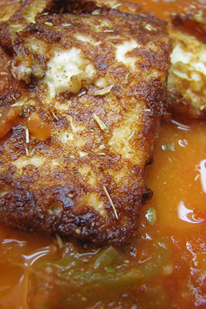 Mexican fried cheese with tomato broth and epazote