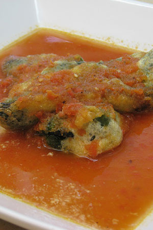 Mexican cheese stuffed poblano peppers in tomato broth