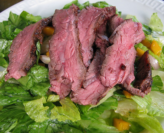 flank steak salad with mango and asian dressing