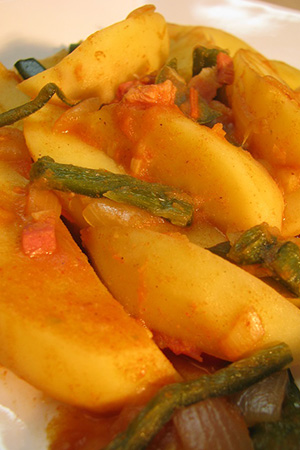 Hungarian paprika potatoes with spicy pepper strips and kolbassa