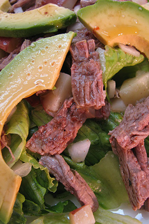 Mexican shredded flank steak salad with potatoes and avocado