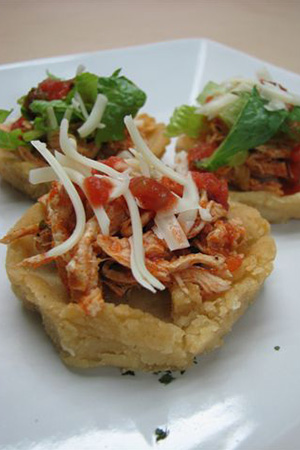 Mexican sopes with homemade corn shells and toppings