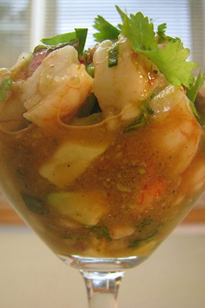 Mexican shrimp seviche with shallots, olives and lime juice